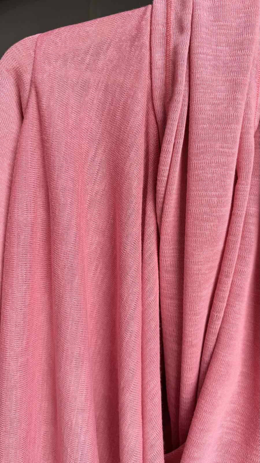 Close-up of pink fabric with a textured pattern