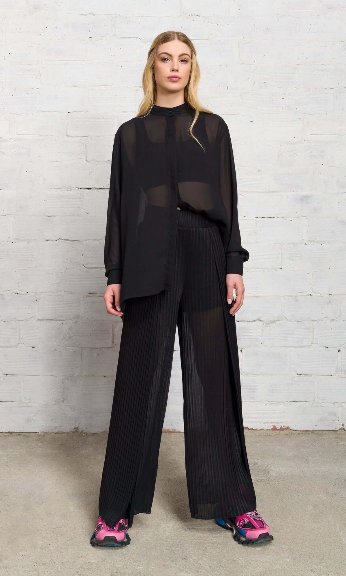 model standing straight in a matching black sheer lounge set