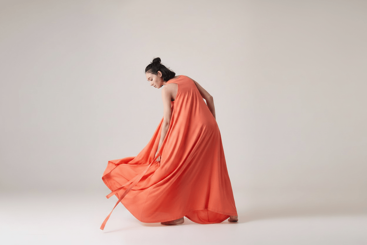 Bright vibrant coral draped dress
