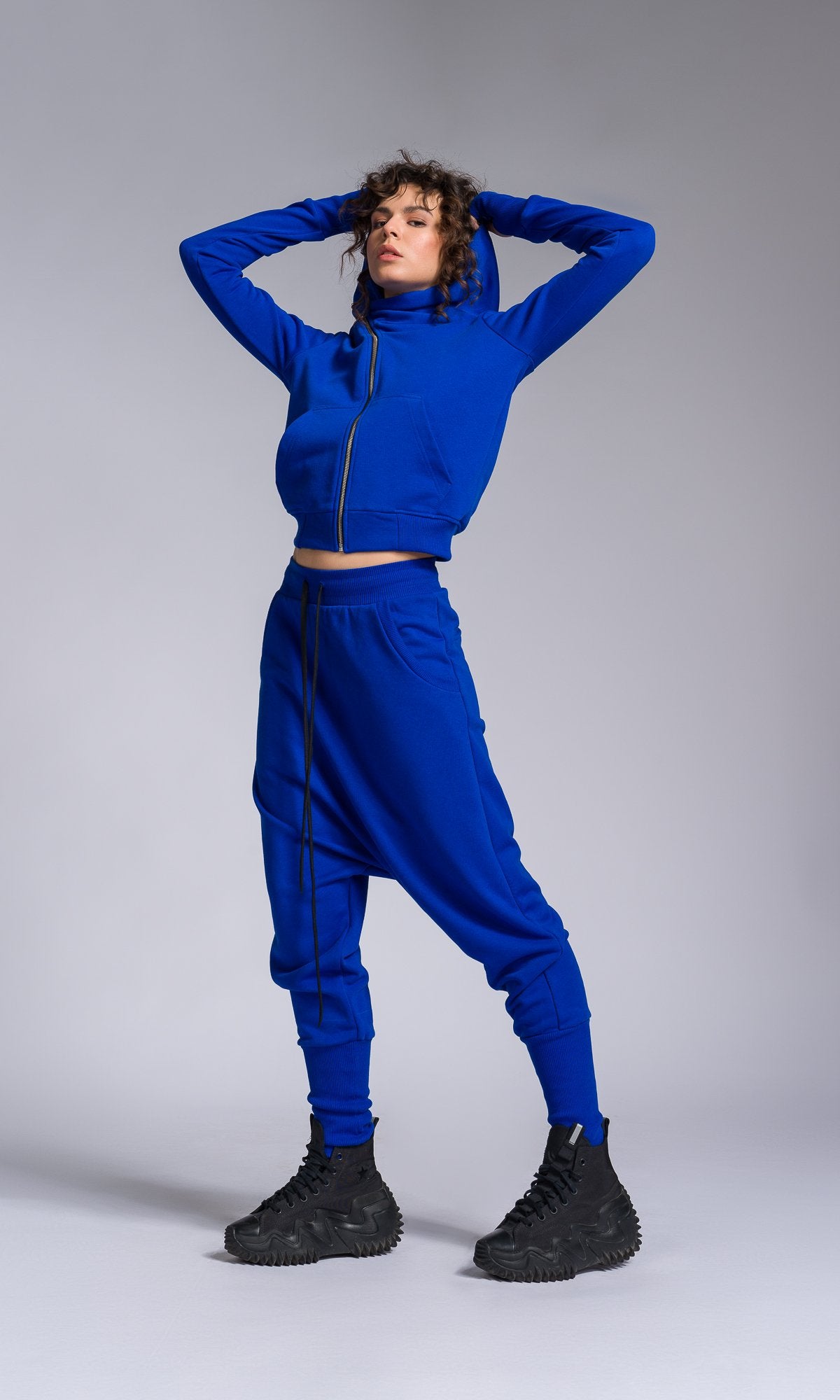 Two-piece Set of Deep Drop Crotch Pants and Asymmetric Short Hoodie
