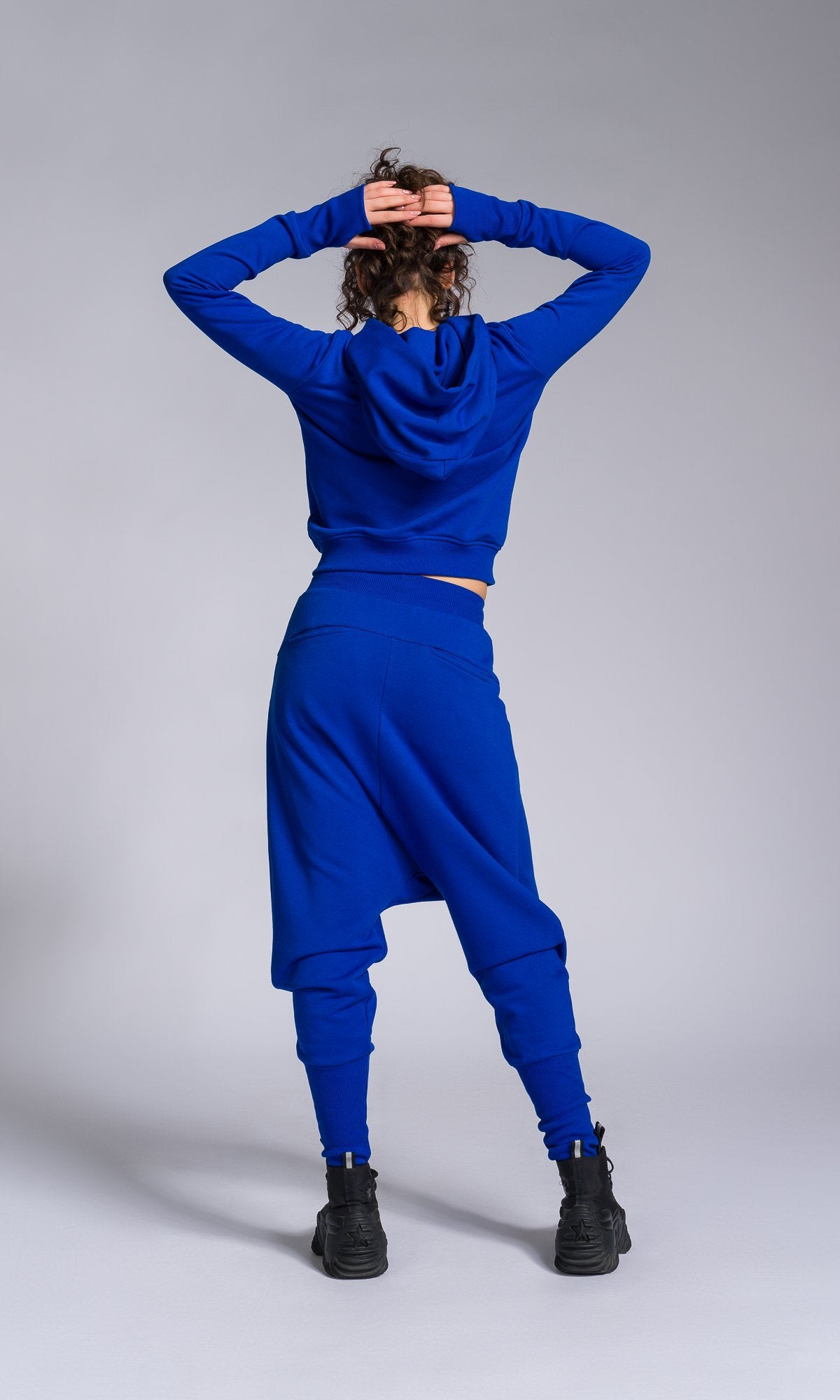 Two-piece Set of Deep Drop Crotch Pants and Asymmetric Short Hoodie - AAKASHA